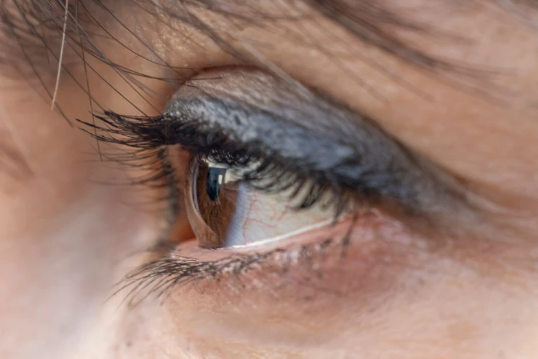 a close up of a persons eye with the eye contacts blurred