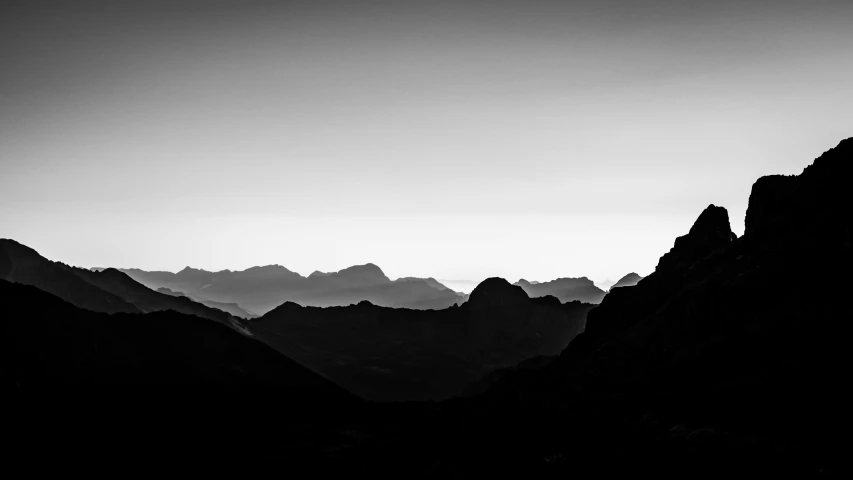 a landscape of mountains and rocks in the night