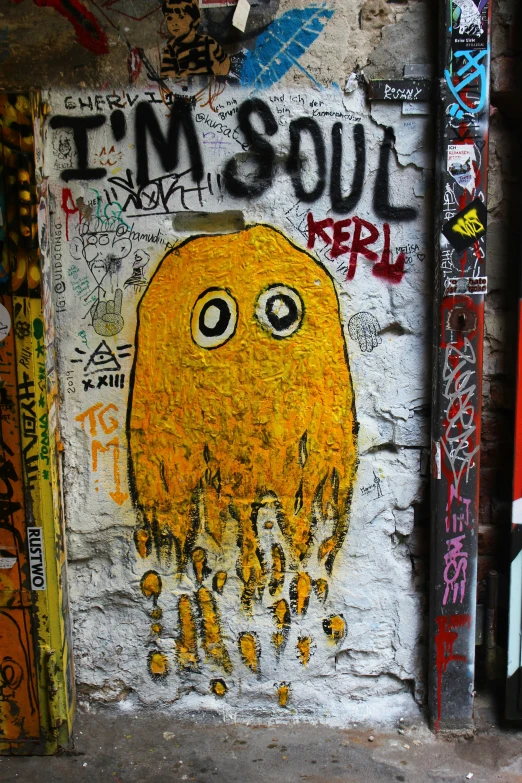 graffiti on the wall of an old brick building with an octo