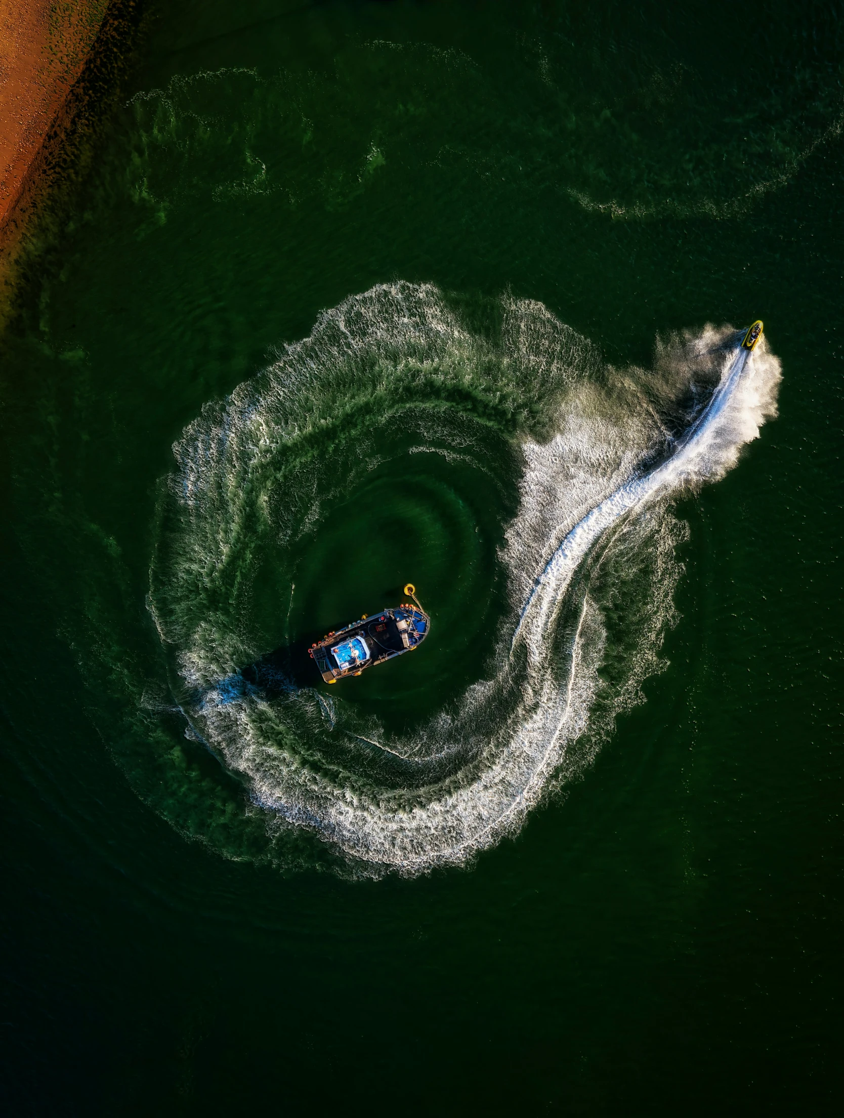 a small boat with an oars on top makes it way through the water