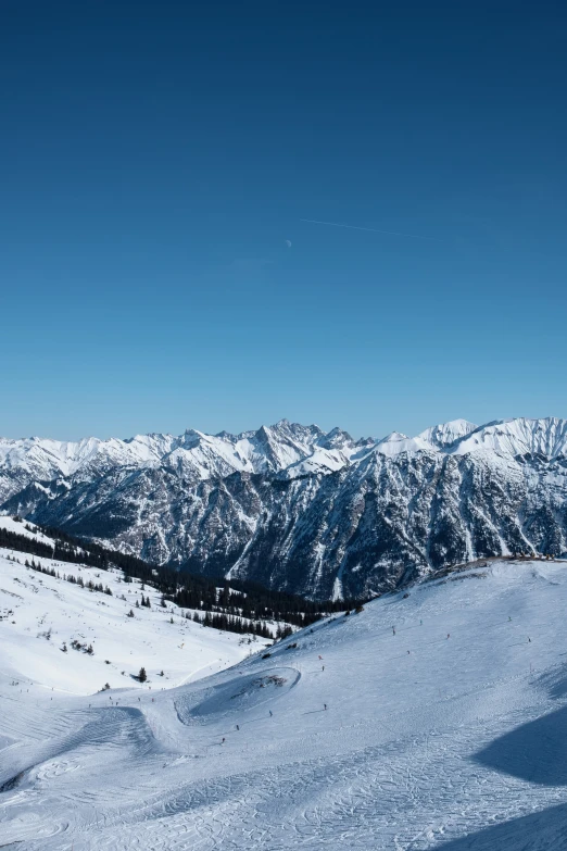 the top of the ski hill has a person on it