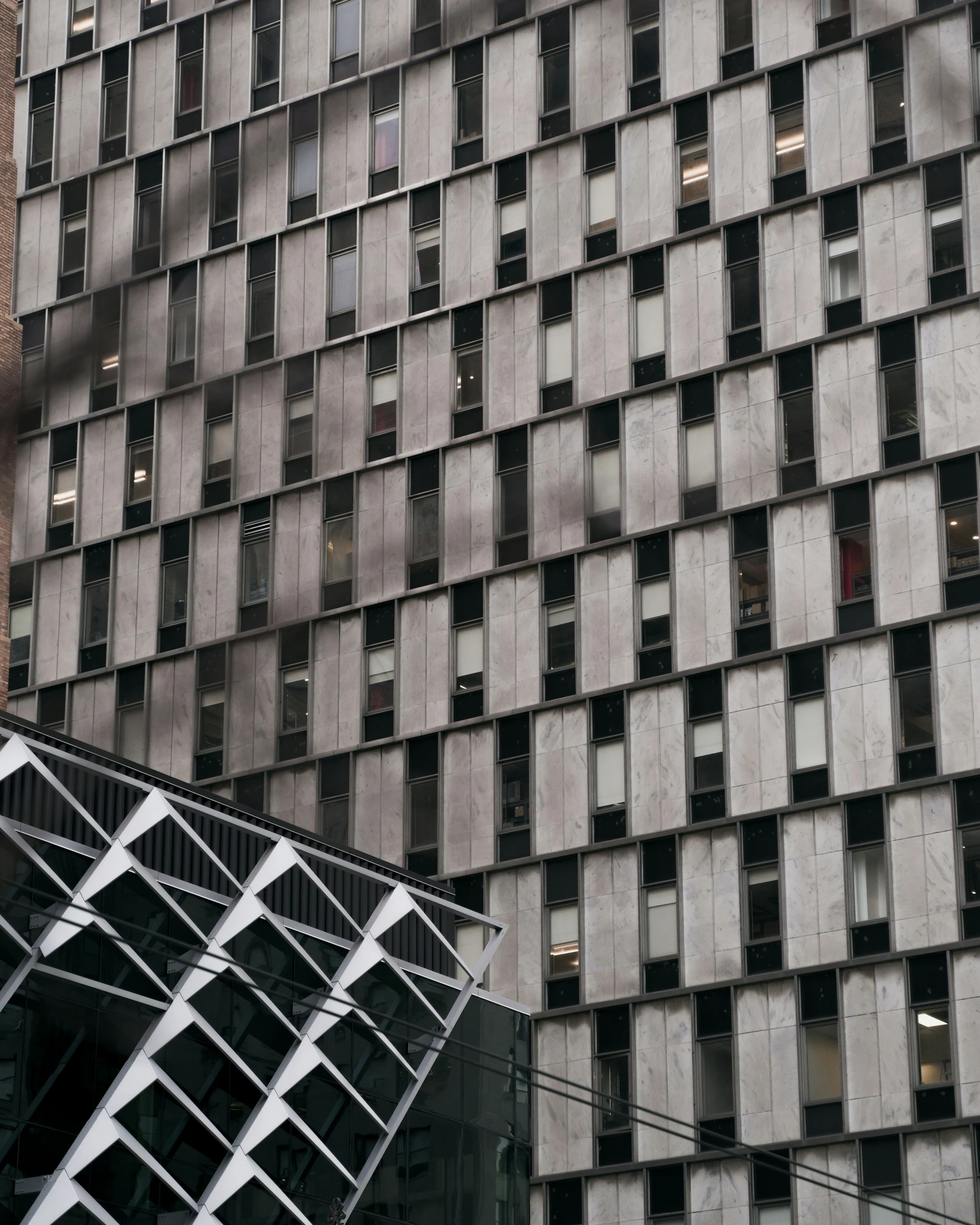 a building made from windows and tiles with a clock