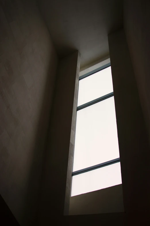 looking up from the corner of a room in which light comes into