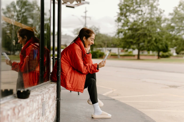 a woman sitting on a bus reading a book