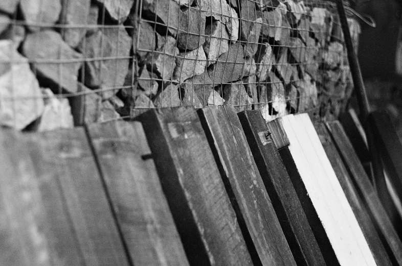 wooden bench sitting in the middle of black and white pograph