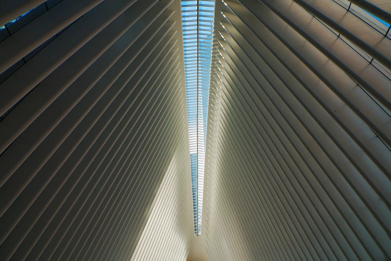 an architectural view looking up into the sky