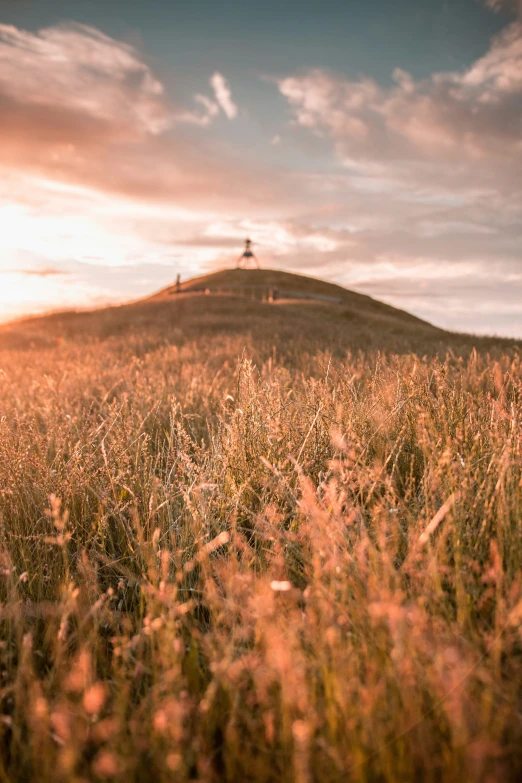 a very tall hill with a tower on top