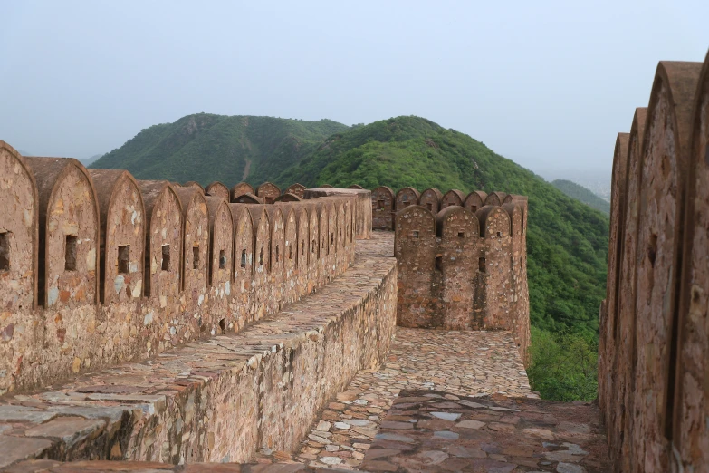 there is an old wall made out of bricks