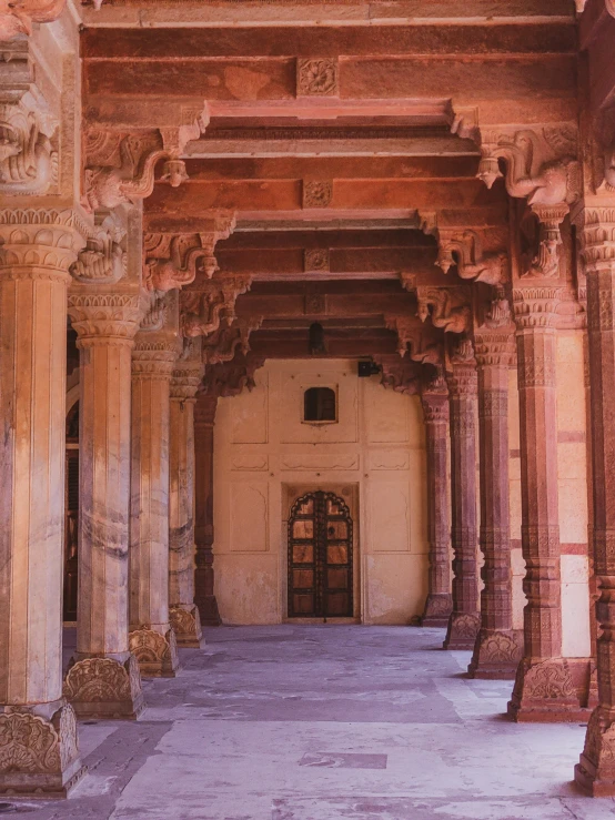 the doorways and arches of a building with intricate carvings