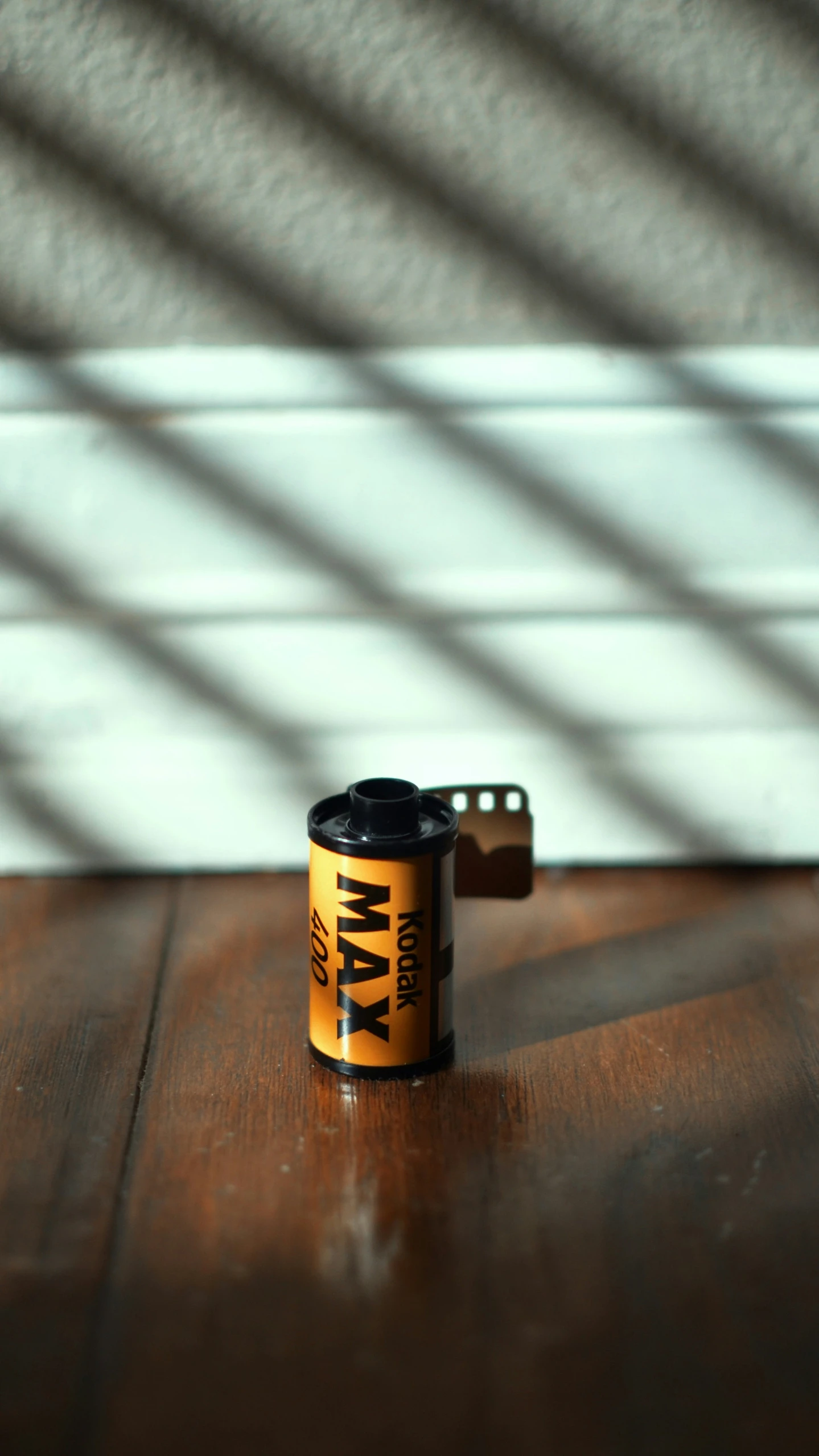 a close up of a cup on top of a wooden table