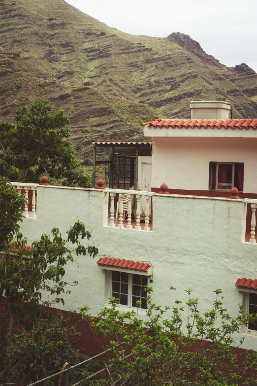 the view of the mountains surrounding the white building