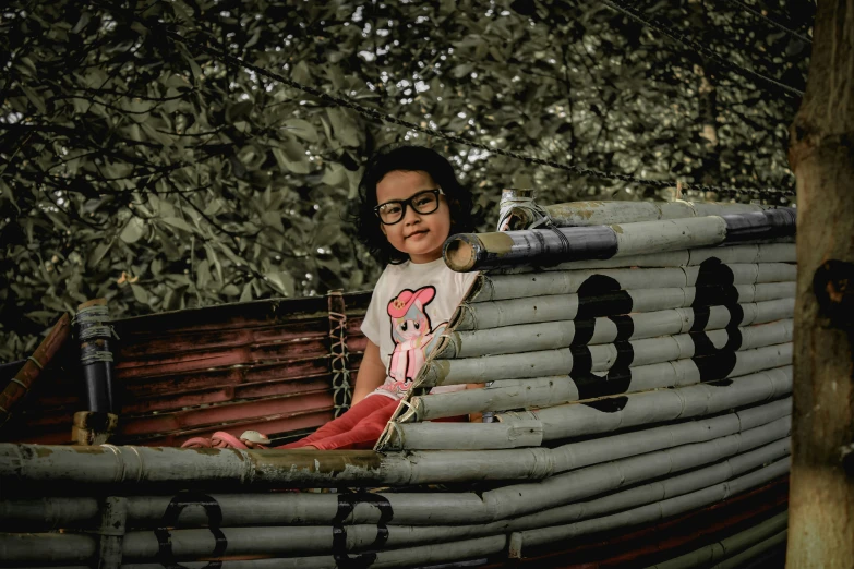 a woman with glasses in a makeshift boat