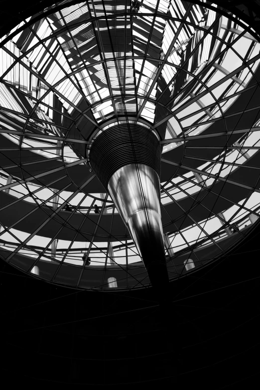 a large glass and metal building with a domed ceiling