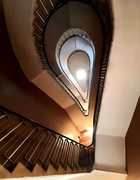 the spiral stairway and light at the bottom of the stairs is empty