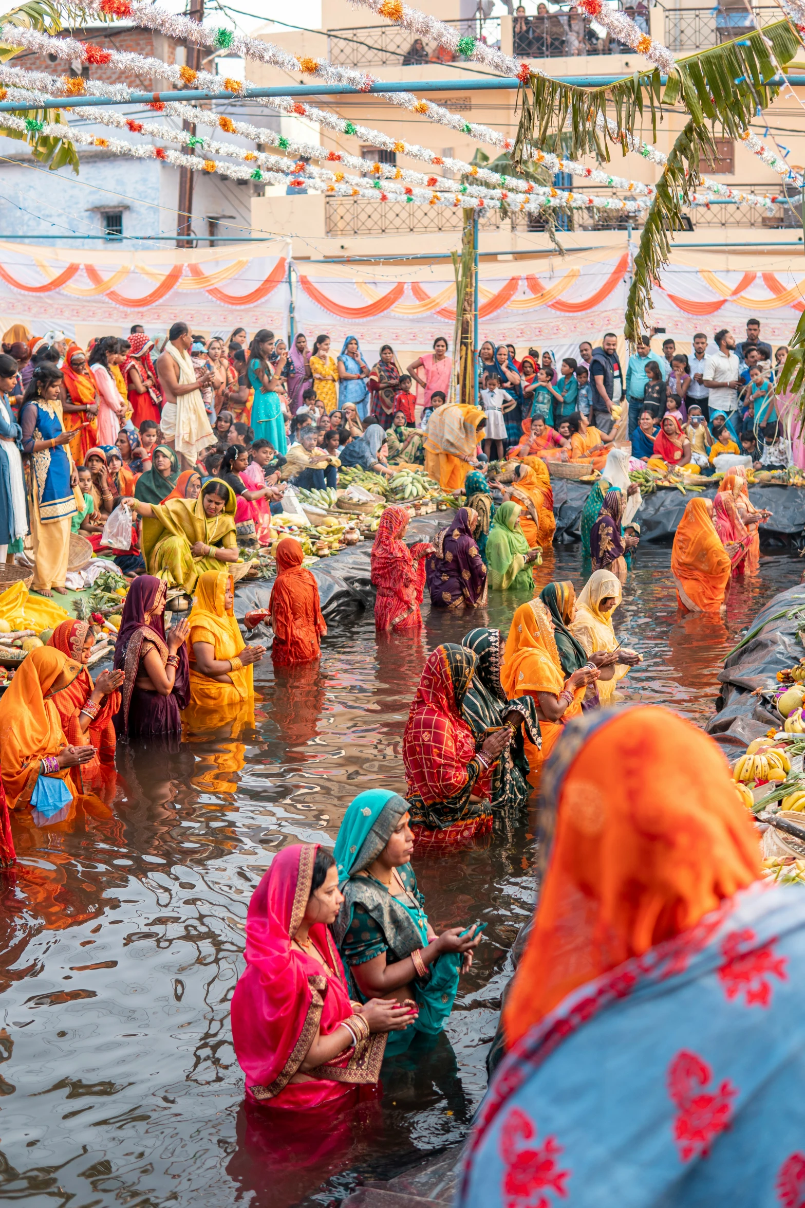 a group of people bathing in a body of water