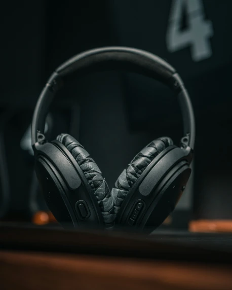 the headphones are made out of black and silver leather