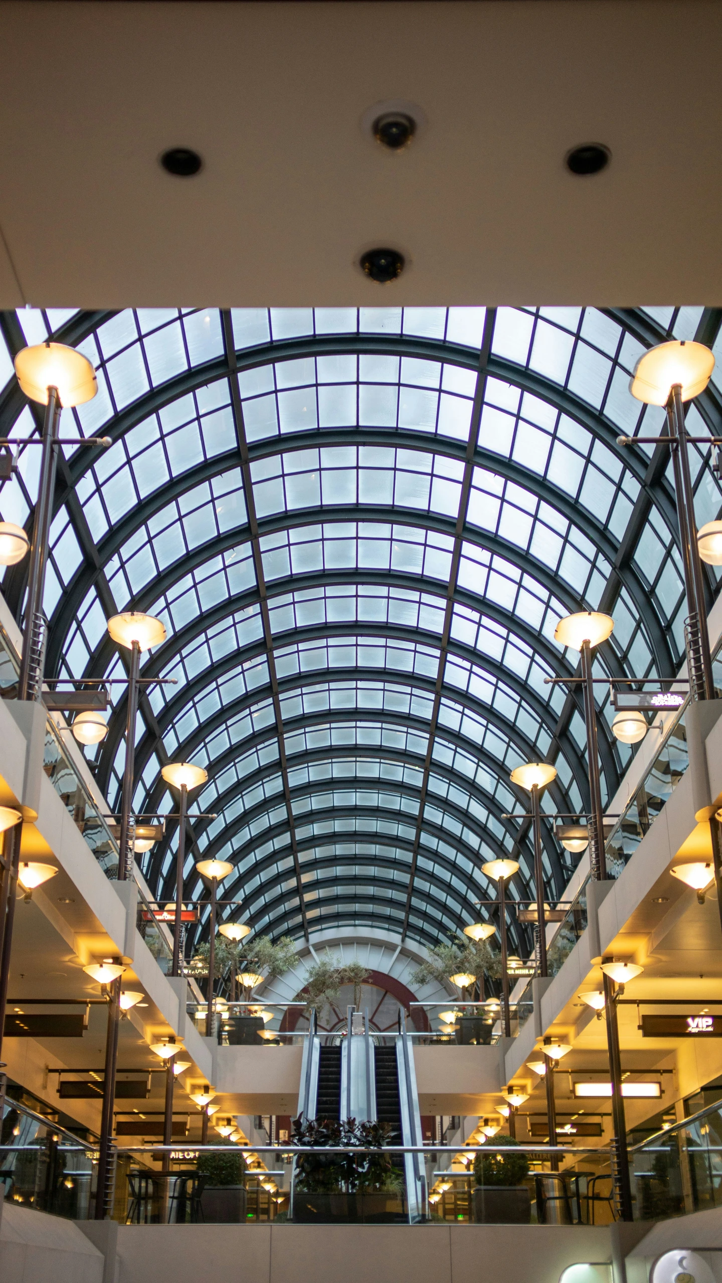large open building with many lighting bulbs on the ceiling