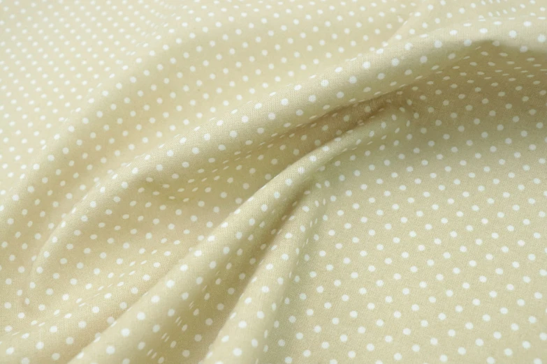 a white polka dot pattern on fabric