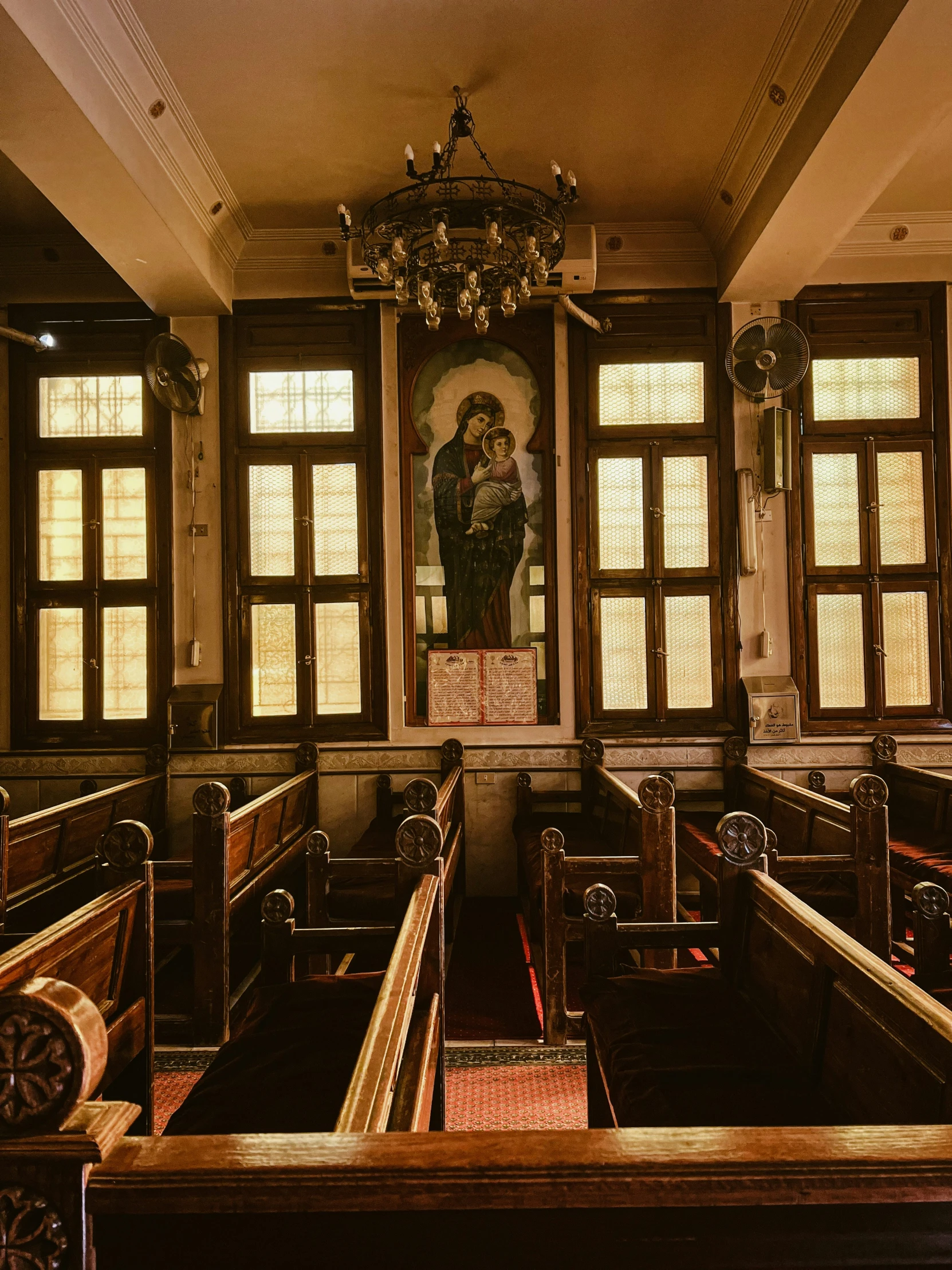 a church filled with wooden pews and windows