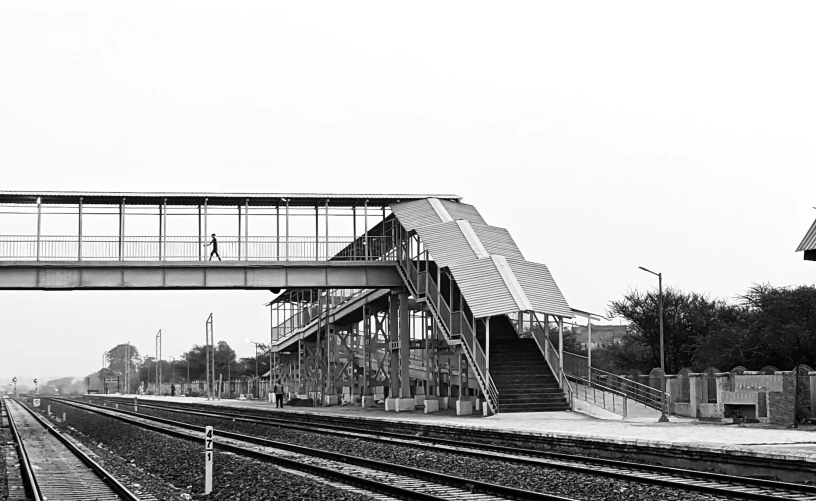 a black and white po of an elevated train station