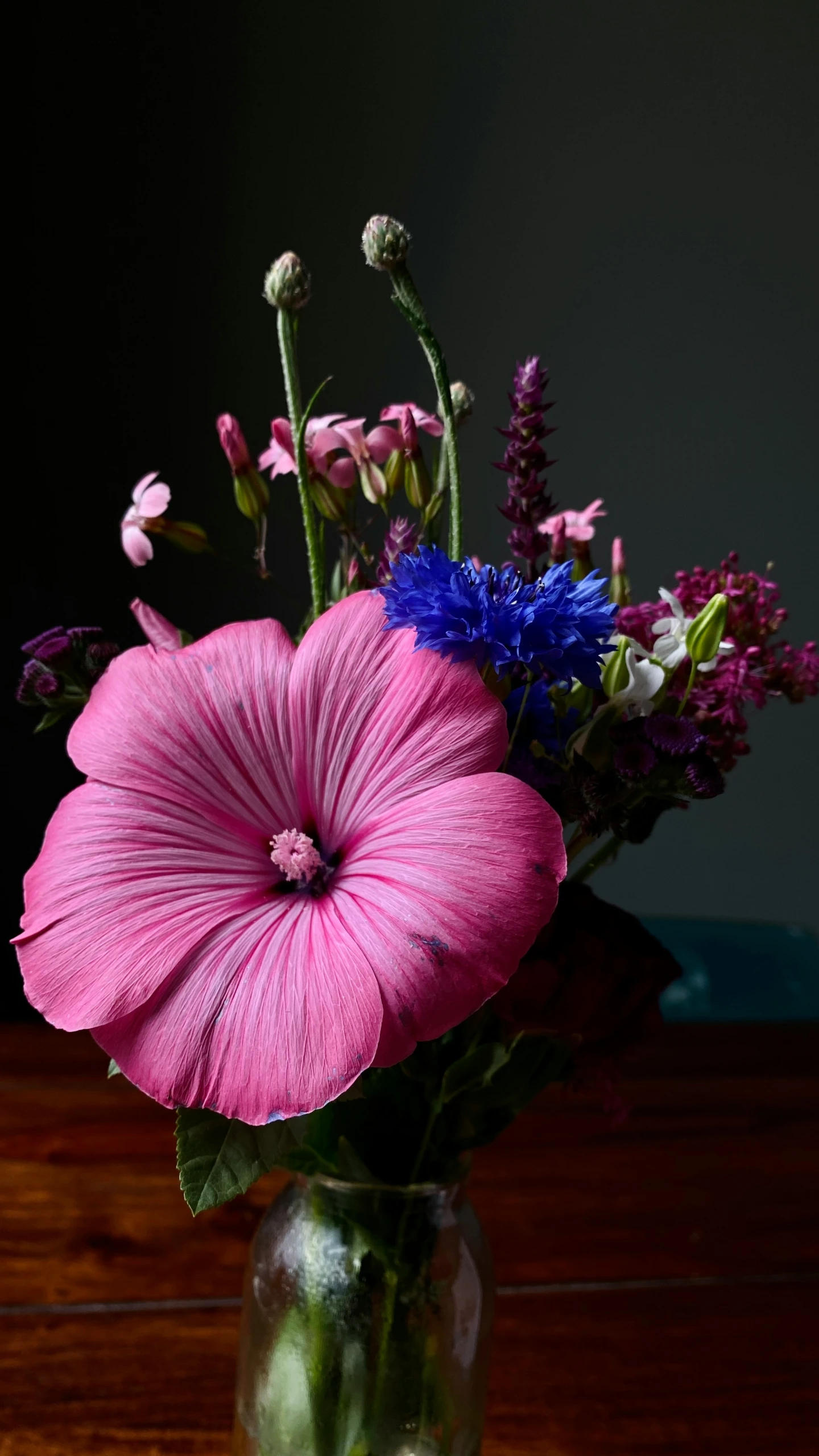 a vase with flowers in it on a table