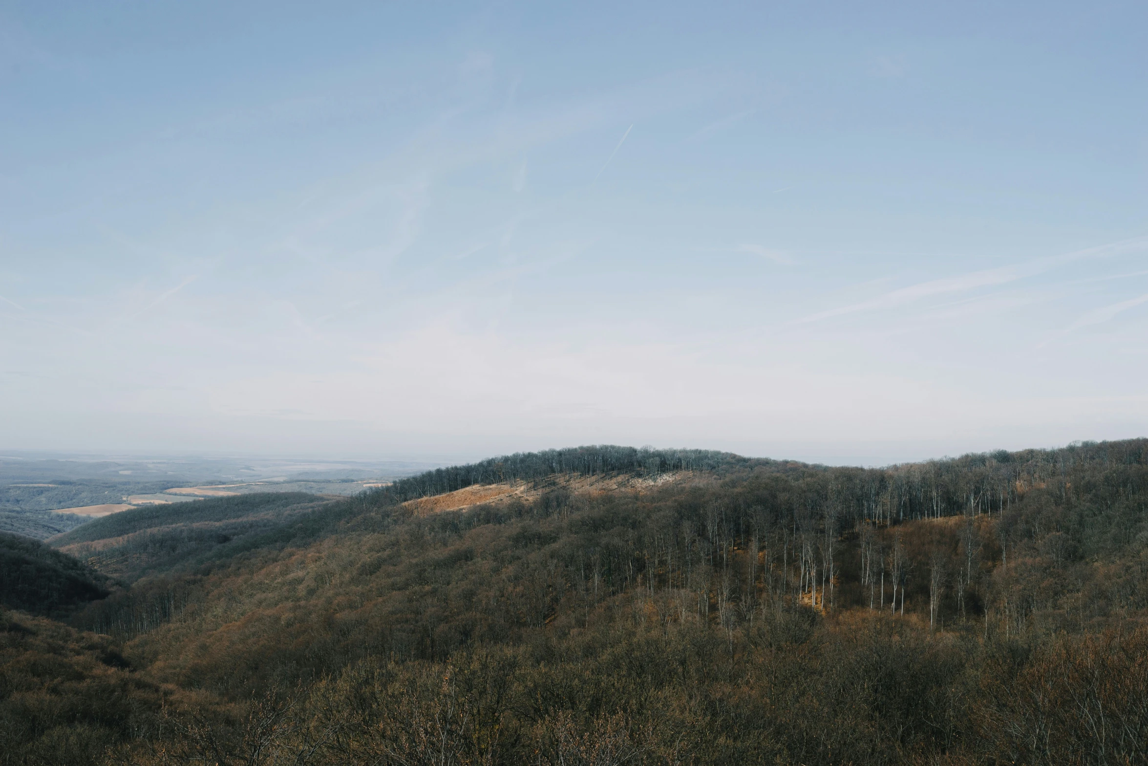 the view looking down on an area in the mountains