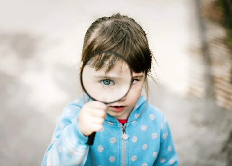 a  looking through a magnifying glass