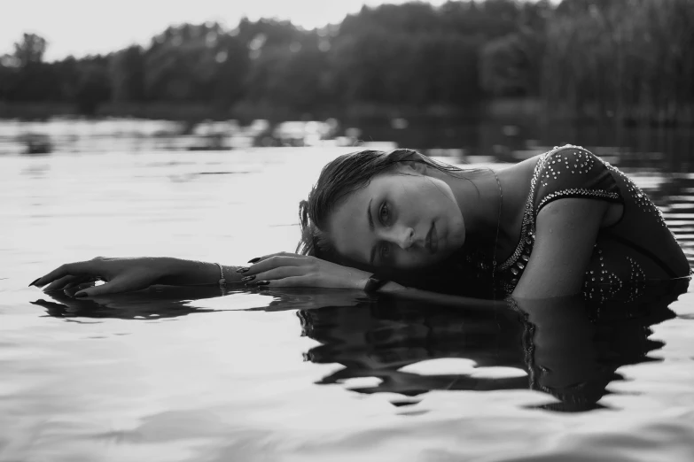 a woman in a bathing suit swimming in the water