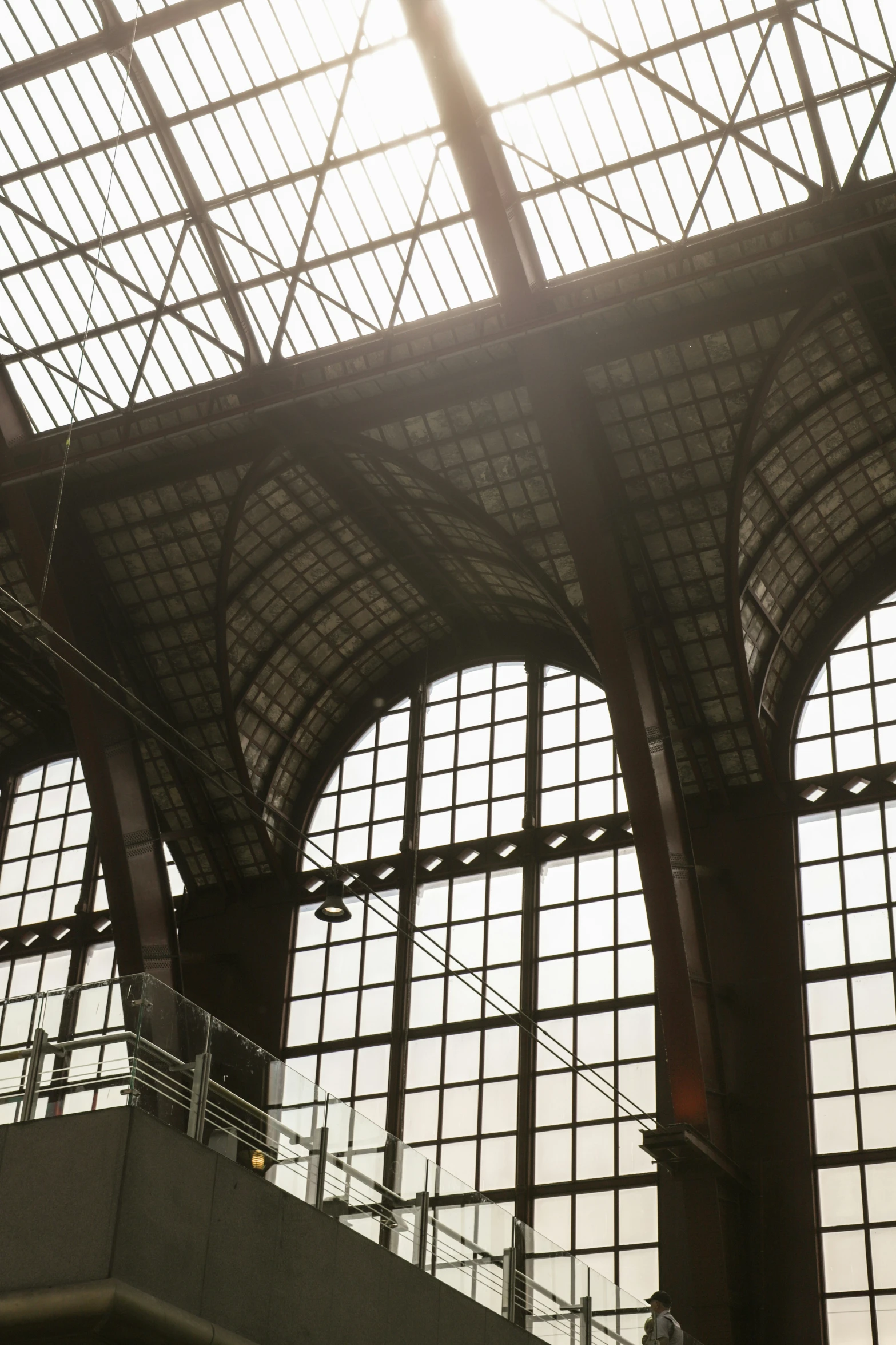 a clock and some windows at a train station