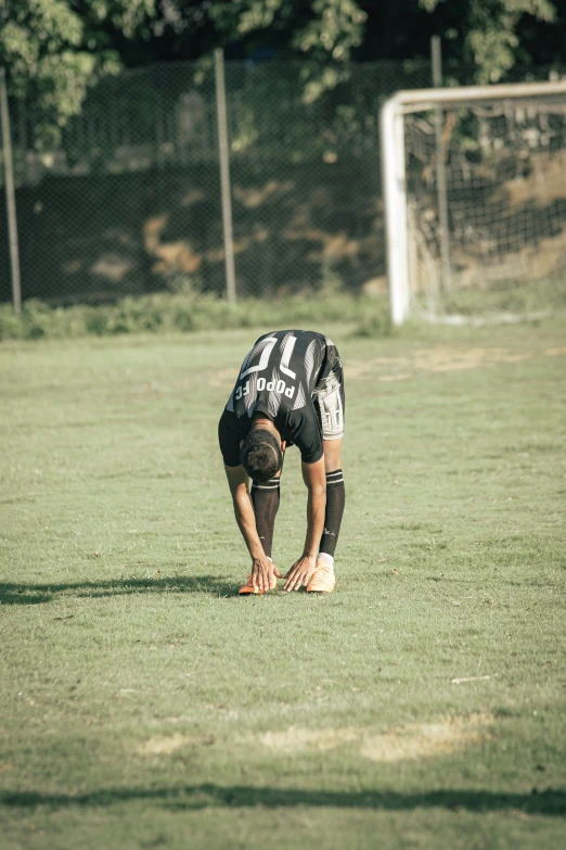 there is a player kneeling in the field during the game