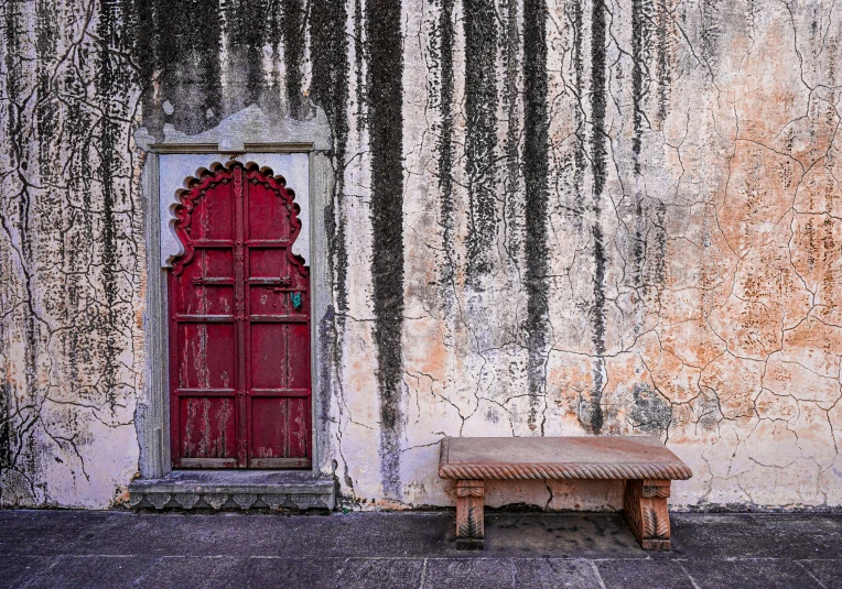 a very big and pretty door by a big building