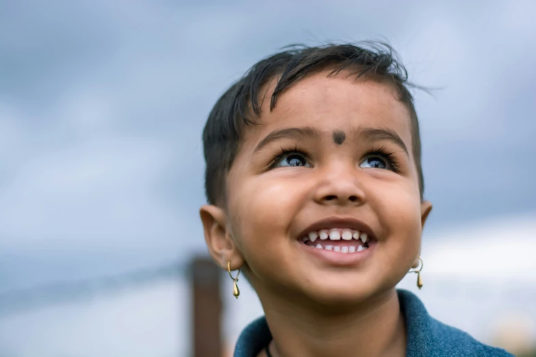 a little boy with a smile on his face