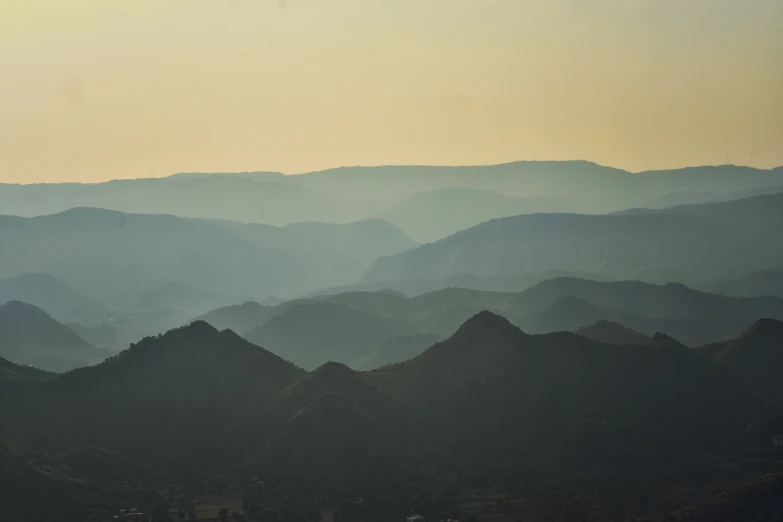 some hills that are in the foreground and some clouds