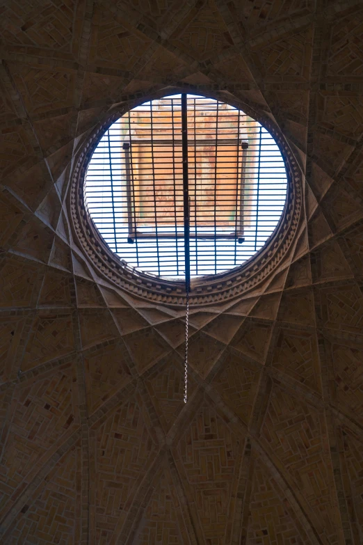 the round window of a structure that looks like a roof