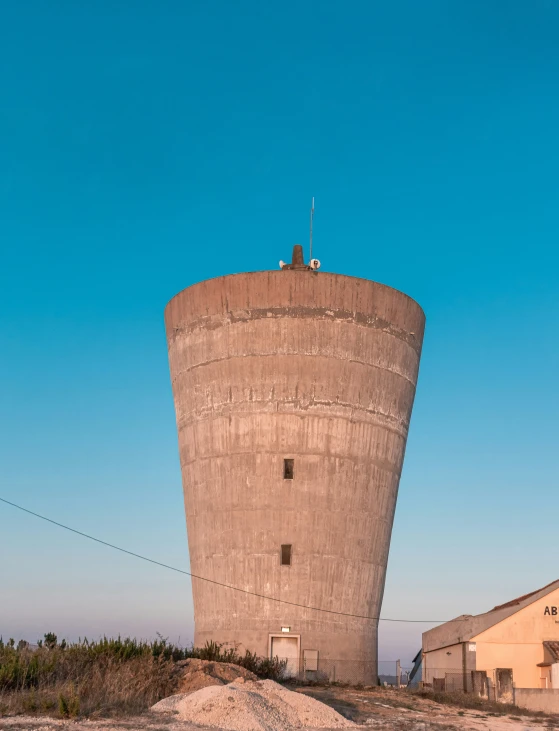 a large tower with a sky background and no other people around it