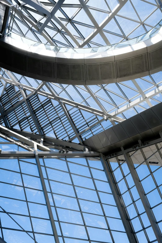 an interior view looking up into a very large skylight