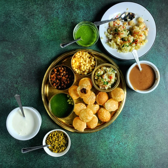 a plate with different kinds of food including beans, rice and other foods