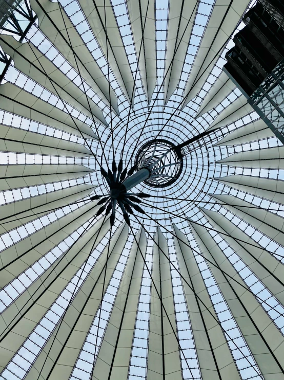 a tall clock sitting underneath a dome roof