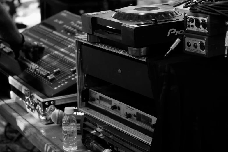 a record player surrounded by other electronic equipment