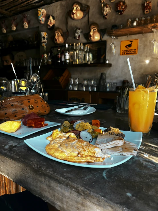 a table topped with two plates filled with food