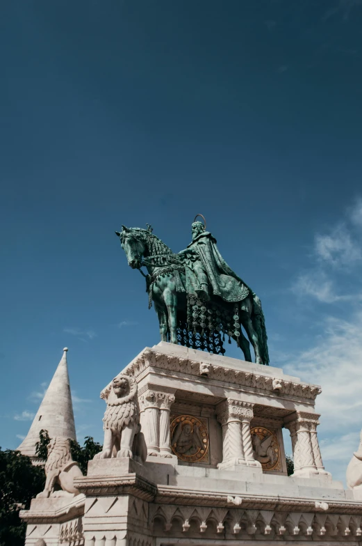 a statue is on top of a building