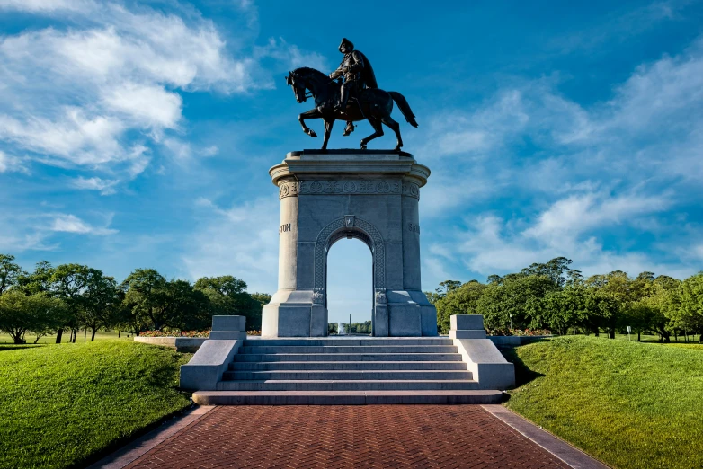 the statue is located next to a long path