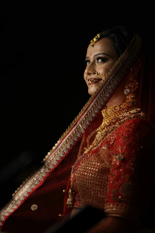 woman in traditional garb smiling at camera