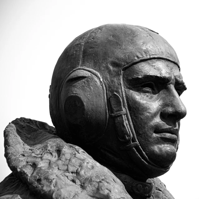 a statue of a man wearing a helmet and head phones