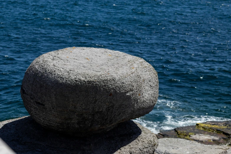 some rocks and a blue body of water