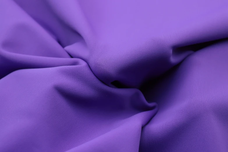 a plain purple fabric that is not very visible