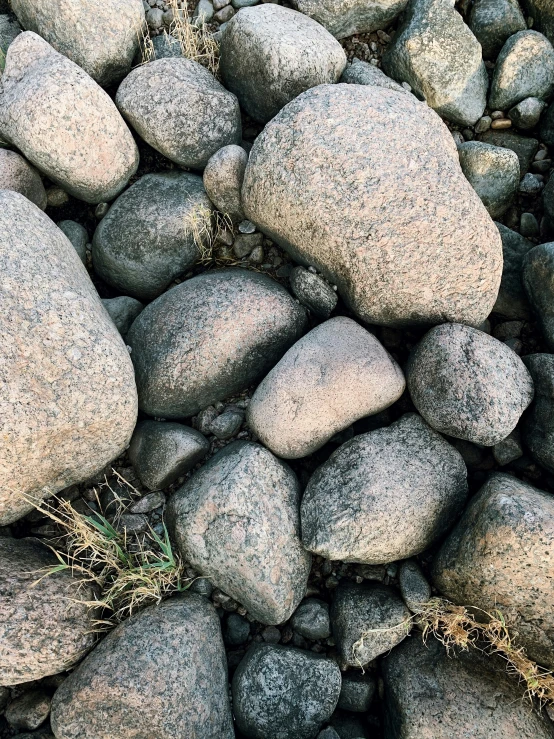 a group of gray rocks sitting on top of each other