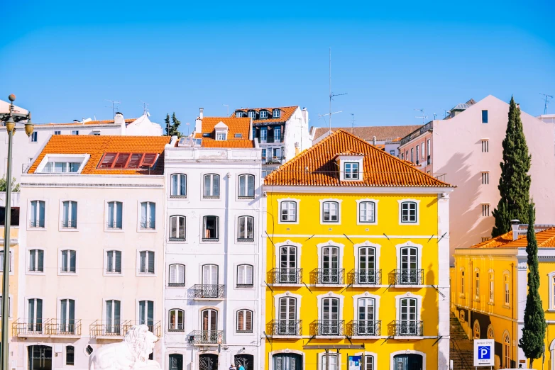 buildings line the side walk in a european city