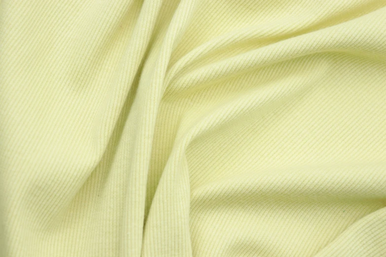 a light yellow fabric texture is shown