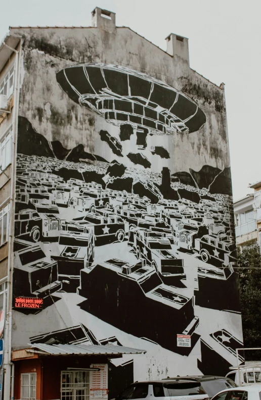 the mural has multiple different types of buildings and is black